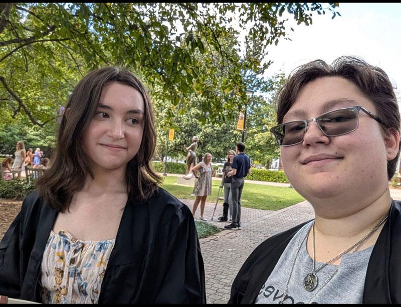 The Fortier siblings smile at an outdoor event on the Converse campus